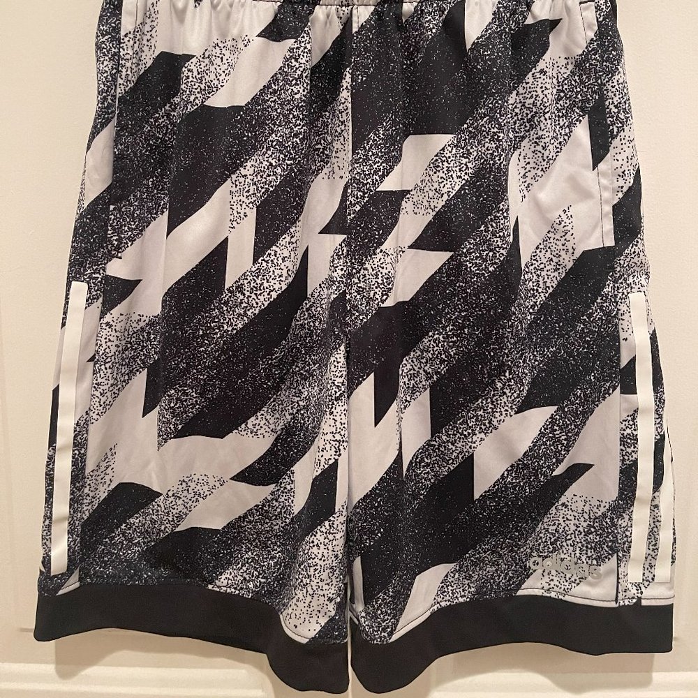 Adidas Navy Blue and White shorts with White stripes.